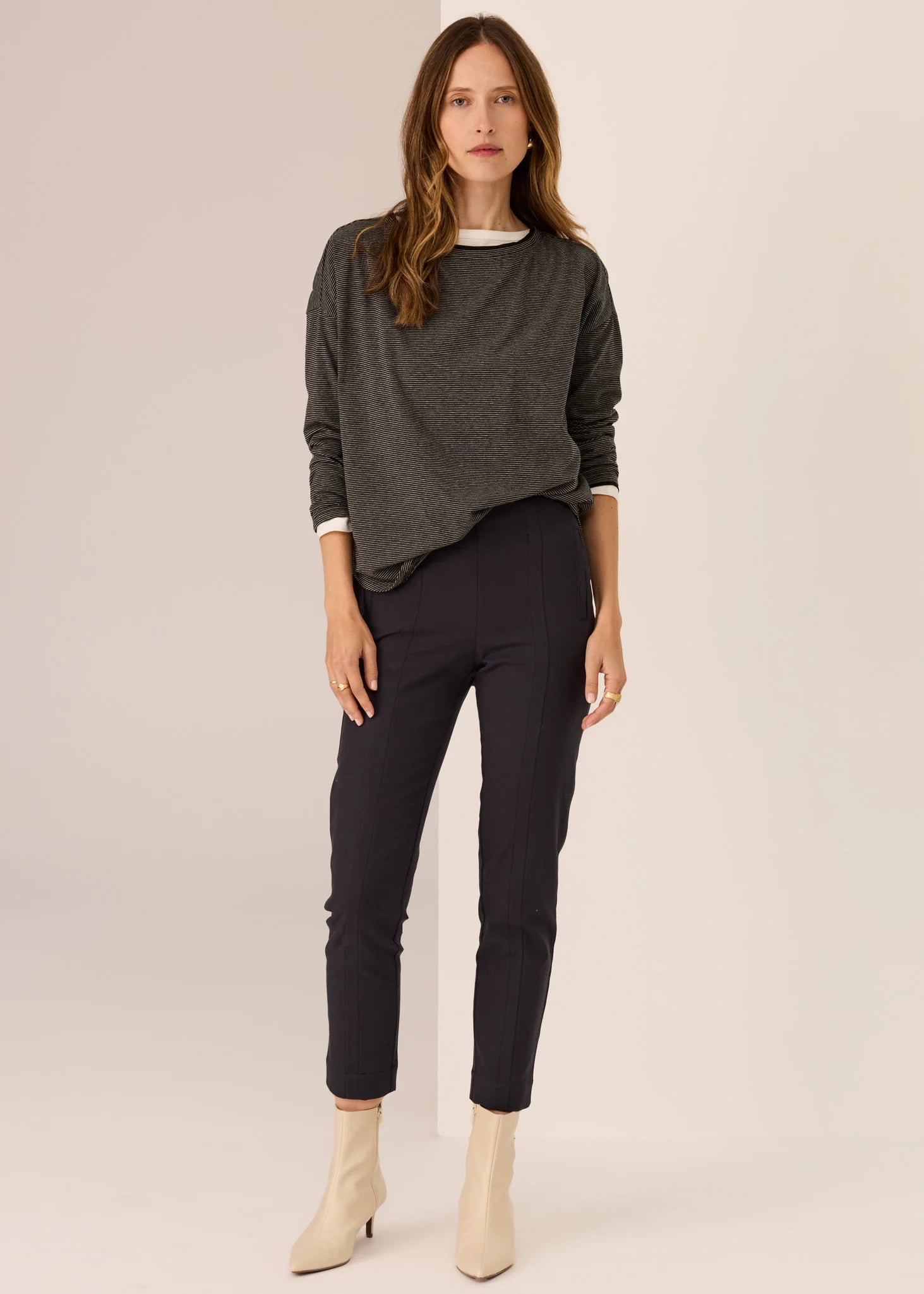 Woman wearing long sleeve tee with white background