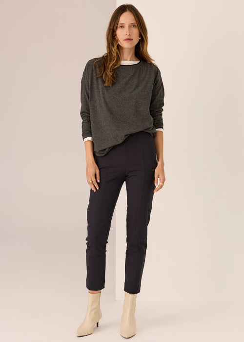 Woman wearing long sleeve tee with white background
