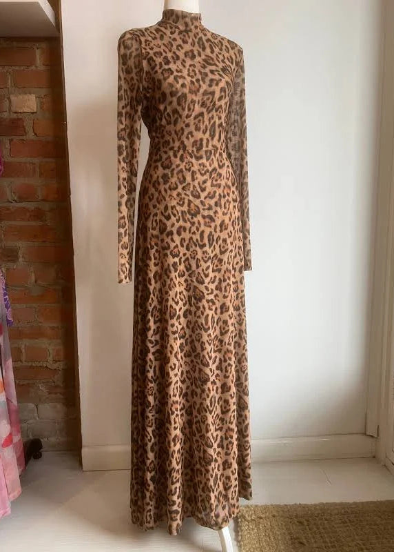 Leopard print dress on a mannequin against a white wall.