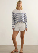 Woman wearing striped top on white background