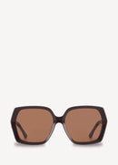 Sunglasses with brown lenses and black frame on a white background
