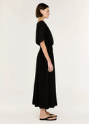 Woman wearing a black dress on a white background