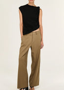 Woman wearing beige pants on a white background