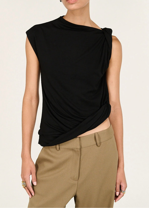 Woman wearing beige pants on a white background