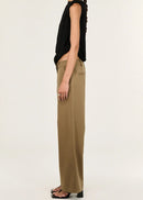 Woman wearing beige pants on a white background