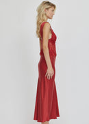 Woman wearing a red lace dress on a white background