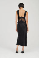Black evening gown with floral embroidery on a white background