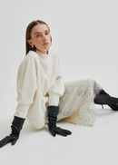 White lace skirt with black gloves on a white background