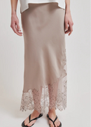 Beige satin skirt with lace hem on a white background